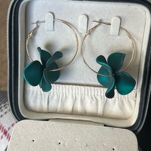 Deep teal hoop earrings with flower design